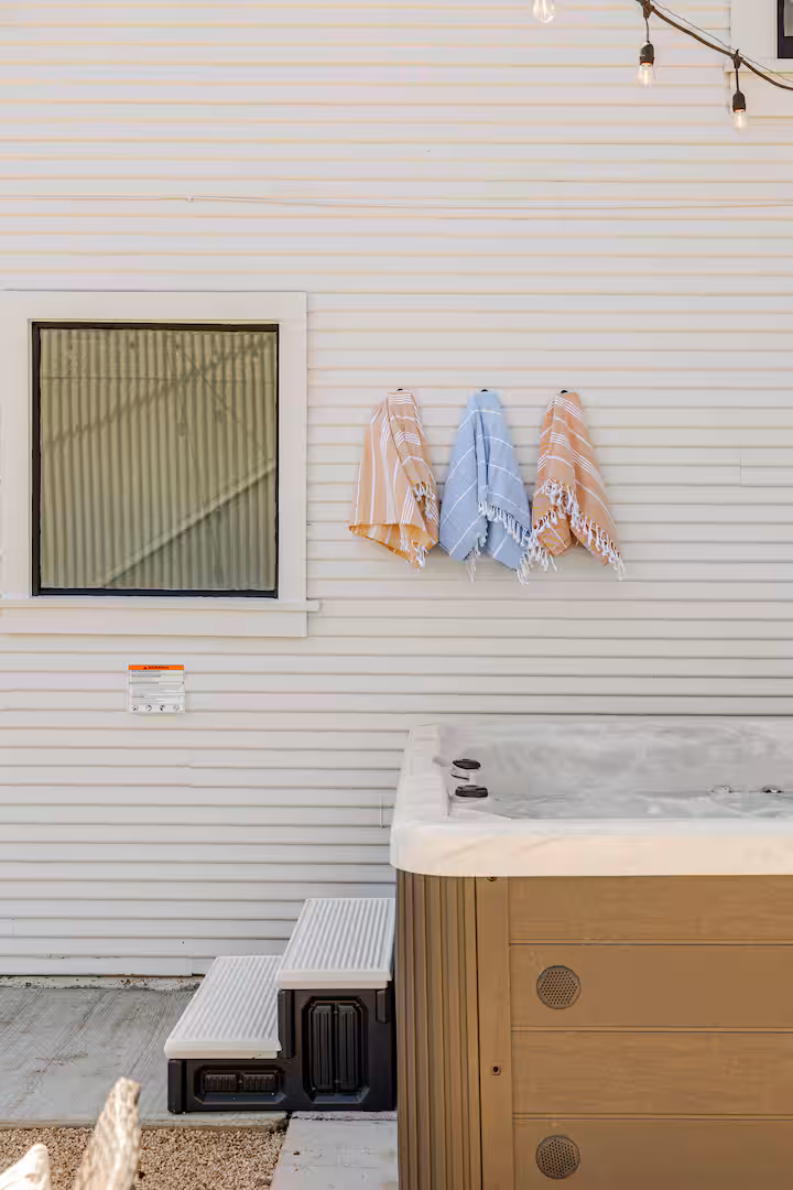 Fresh towels hanging above the private Carriage House hot tub.