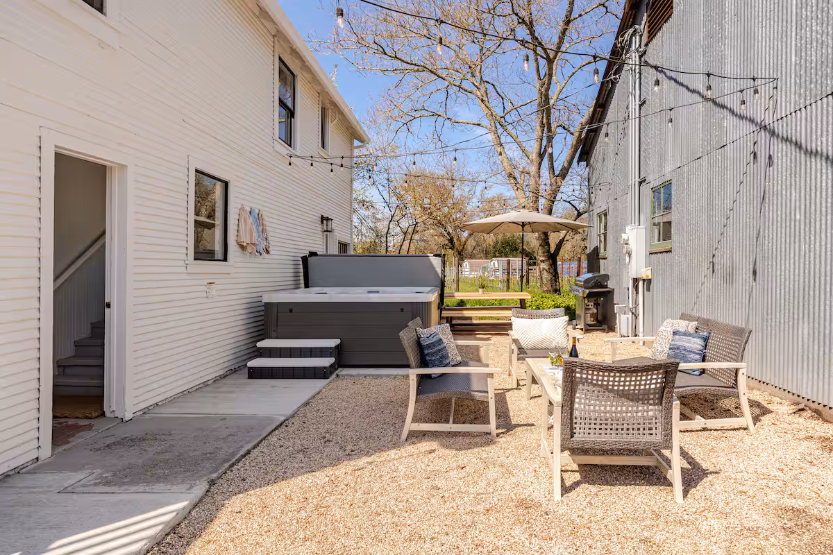 Private hot tub and outdoor living space at The Carriage House in Kenwood.