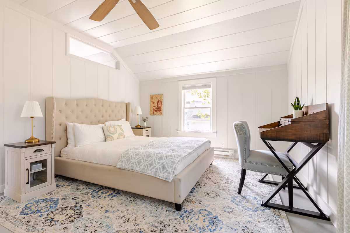 Queen bedroom inside The Carriage House vineyard stay in Kenwood.