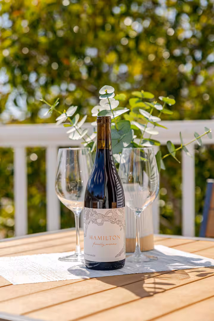 A bottle of Hamilton wine waiting on the Carriage House balcony.